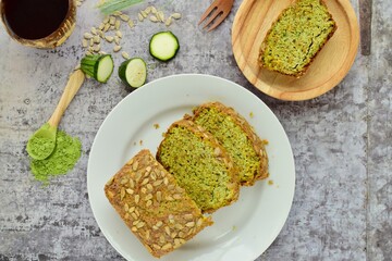 Slices of wheatgrass zucchini bread with sunflower seeds