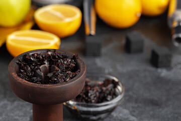 Shisha parts, tobacco and lemons close up