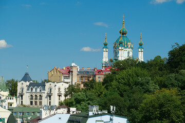 Fototapeta na wymiar View of historic Podil neighborhood of Kyiv and St Andrews Church, Ukraine