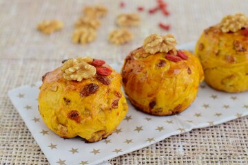 Homemade healthy delicious bread buns with walnut and goji berry. Selective focus
