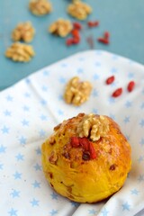 Homemade healthy delicious bread buns with walnut and goji berry. Selective focus, blurred background