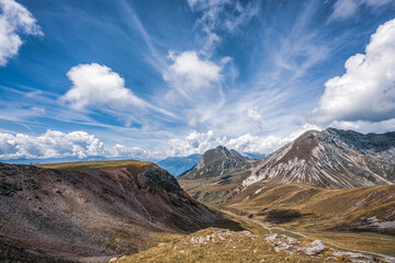 panoramic view of the Dolomites with beautiful weather clouds , Italy.