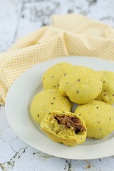 Turmeric black sesame bread buns with chicken filling
