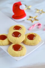 Thumbprint cookies on white background with Christmas decoration
