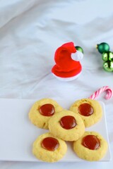 Thumbprint cookies on white background with Christmas decoration
