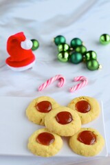 Thumbprint cookies on white background with Christmas decoration

