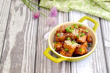 Diced tofu with soy sauce, sesame seed and chives.