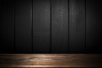 Selected focus empty brown wooden table and wall texture or old black brick wall blur background image. for your photomontage or product display