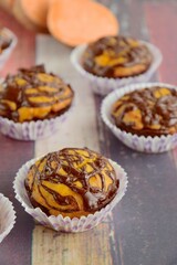 Sweet potato muffins with chocolate sauce topping