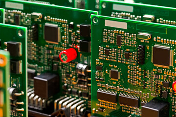 Fototapeta premium Electronic Ideas. Extreme Close-up of Produced Automotive Printed Circuit Boards with Soldered SMD or Surface Mounted Components.