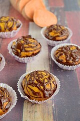 Sweet potato muffins with chocolate sauce topping