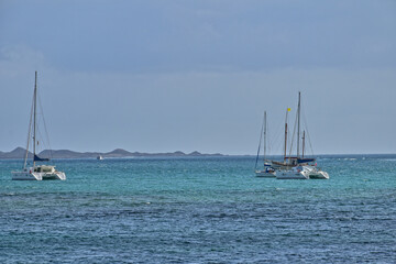  oceanic calm landscape on the Spanish island of Fuerteventura with boats