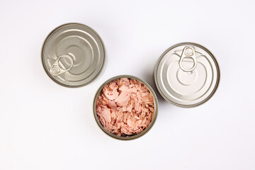 Tuna fish meat flaky chunk in tin can on white background