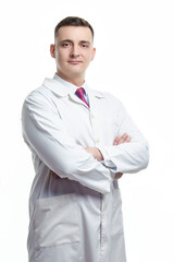 Medical Concepts. Portrait of Smiling Professional Mature GP Doctor Posing in Doctor's Smock and Folded Hands on White Background.