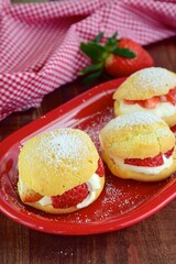 Choux pastry filled with whipped cream and strawberry