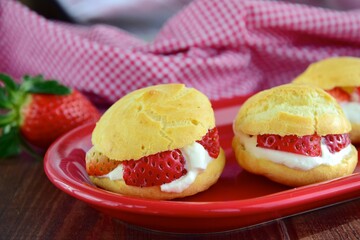 Choux pastry filled with whipped cream and strawberry