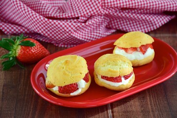Choux pastry filled with whipped cream and strawberry