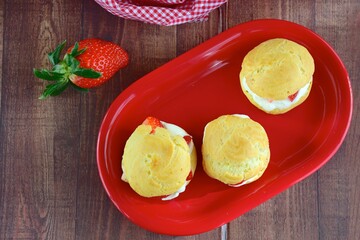 Choux pastry filled with whipped cream and strawberry