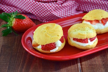 Choux pastry filled with whipped cream and strawberry