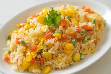 fried rice with mixed vegetable (carrot, green bean peas, corn) and egg