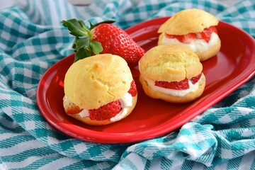 Choux pastry filled with whipped cream and strawberry