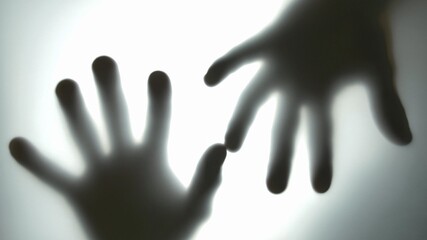 Male Hands Behind Translucent Glass Touching Scratching and Stroking the Surface