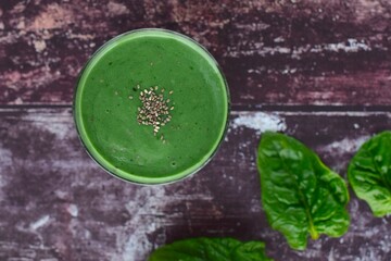Spirulina spinach green smoothie with chia seeds. wooden background. Flat lay