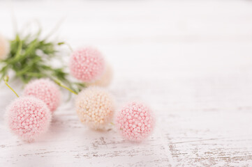 Flowers composition for Valentine's, Mother's or Women's Day. Pink flowers on old white wooden background. Still-life.