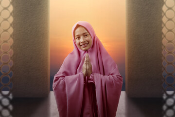 Asian Muslim woman in veil with greeting gesture