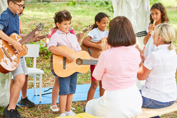 Children's group as a band at talent show