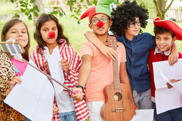 Children in funny disguise at a talent show