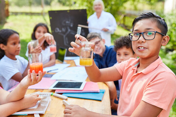 Children have fun doing chemistry experiment