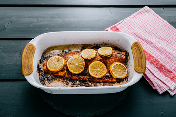 Salmon baked with lemon slices and soy