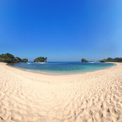 Stunning view, Crystal clear water & white sand beach at Watu Karung Beach Pacitan East Java Indonesia