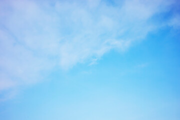 Naklejka na ściany i meble Blue sky background and white clouds soft focus, and copy space horizontal shape