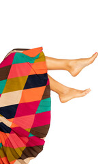 Fototapeta na wymiar Female legs and colorful skirt, isolated on white background.