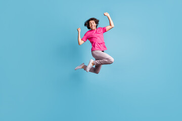 Fototapeta na wymiar Full length body size view of nice cheery funky guy hipster jumping having fun rejoicing isolated over bright blue color background