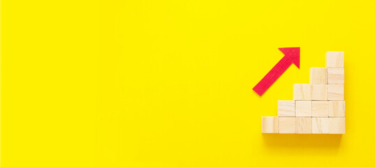 Business growth concept abstract yellow background. Red arrow wooden stairs. Banner