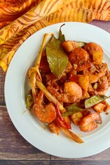 Sambal goreng kentang udang. Fried cubed potato with prawns cooked with coconut milk and spices (Indonesian food)