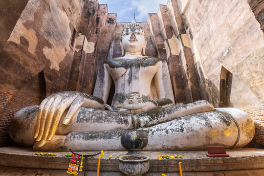 Famous big Buddha statue image named Phra Achana situated in ruined chapel at Wat Si Chum temple, Sukhothai Historical Park, Thailand