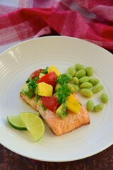 Grilled salmon with mango avocado tomato salsa and edamame beans