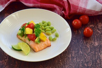Grilled salmon with mango avocado tomato salsa and edamame beans