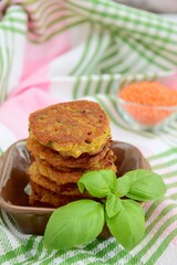Patties of red lentils with basil leaf 