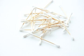 Wooden cotton swabs on white background. Sustainability and eco living concept