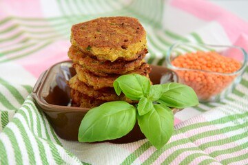 Red lentils patties with basil leaf 