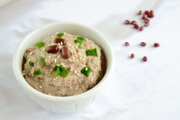 Adzuki bean tahini dip on white background