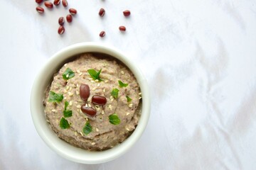 Adzuki bean tahini dip on white background