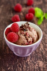 Chocolate raspberry ice cream with mint leaf