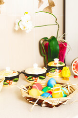 Easter eggs in a basket on a table