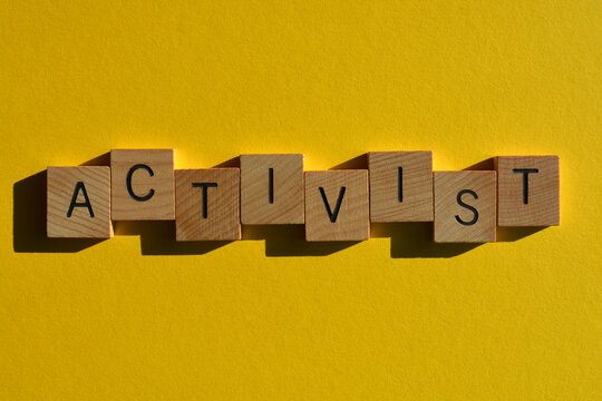 Activist, words in wooden alphabet letters